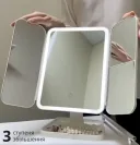 Photo 2 — Tri-fold mirror with LED light, magnification, touch screen, on stand