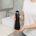Фото 6 — Ирригатор для полости рта портативный аккумуляторный с USB-зарядкой, резервуар 150 мл, 4 насадки, черный